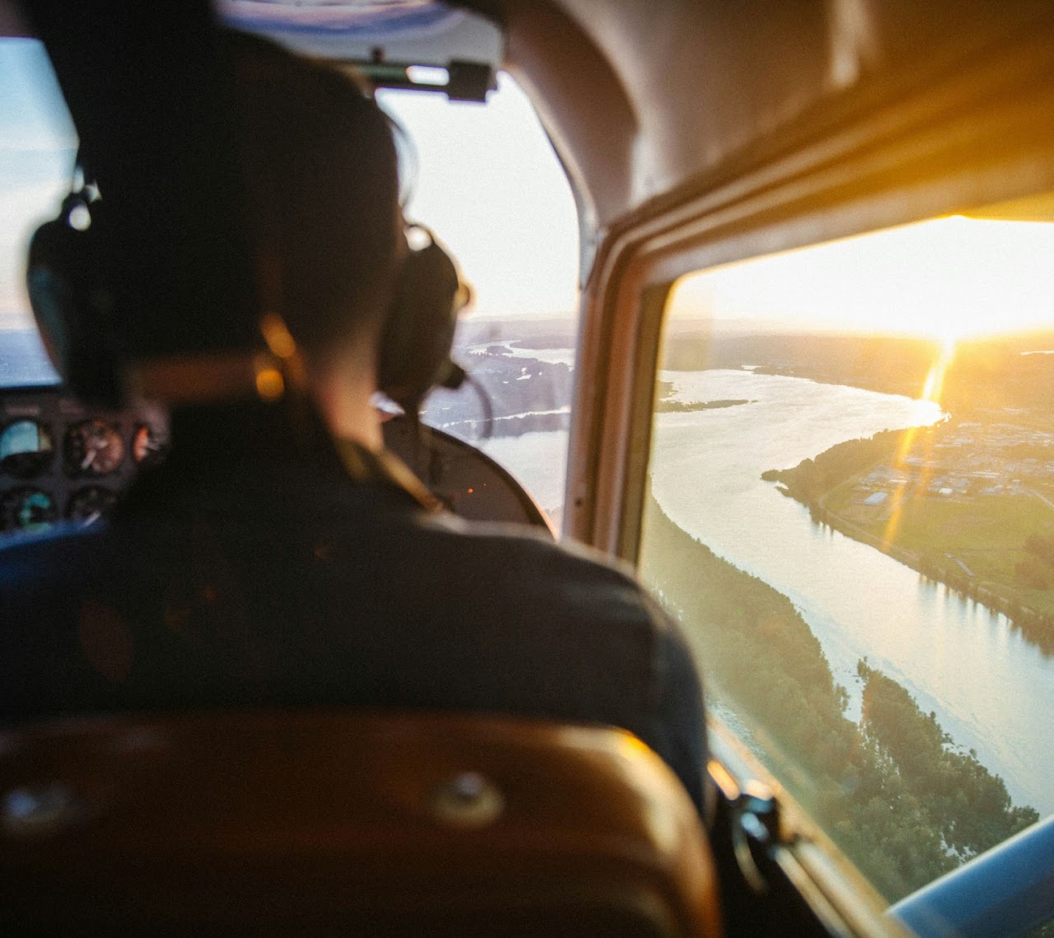 View from inside a general aviation aircraft at sunset